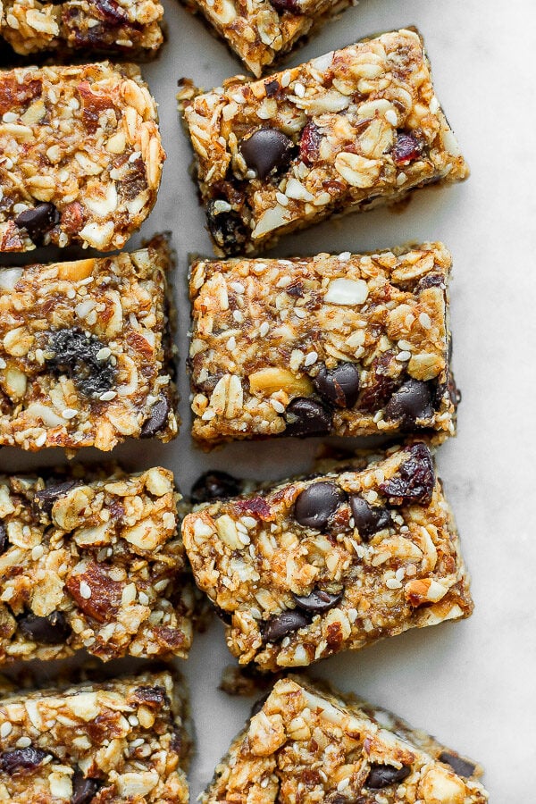 Several trail mix bars cut apart and sitting next to each other.