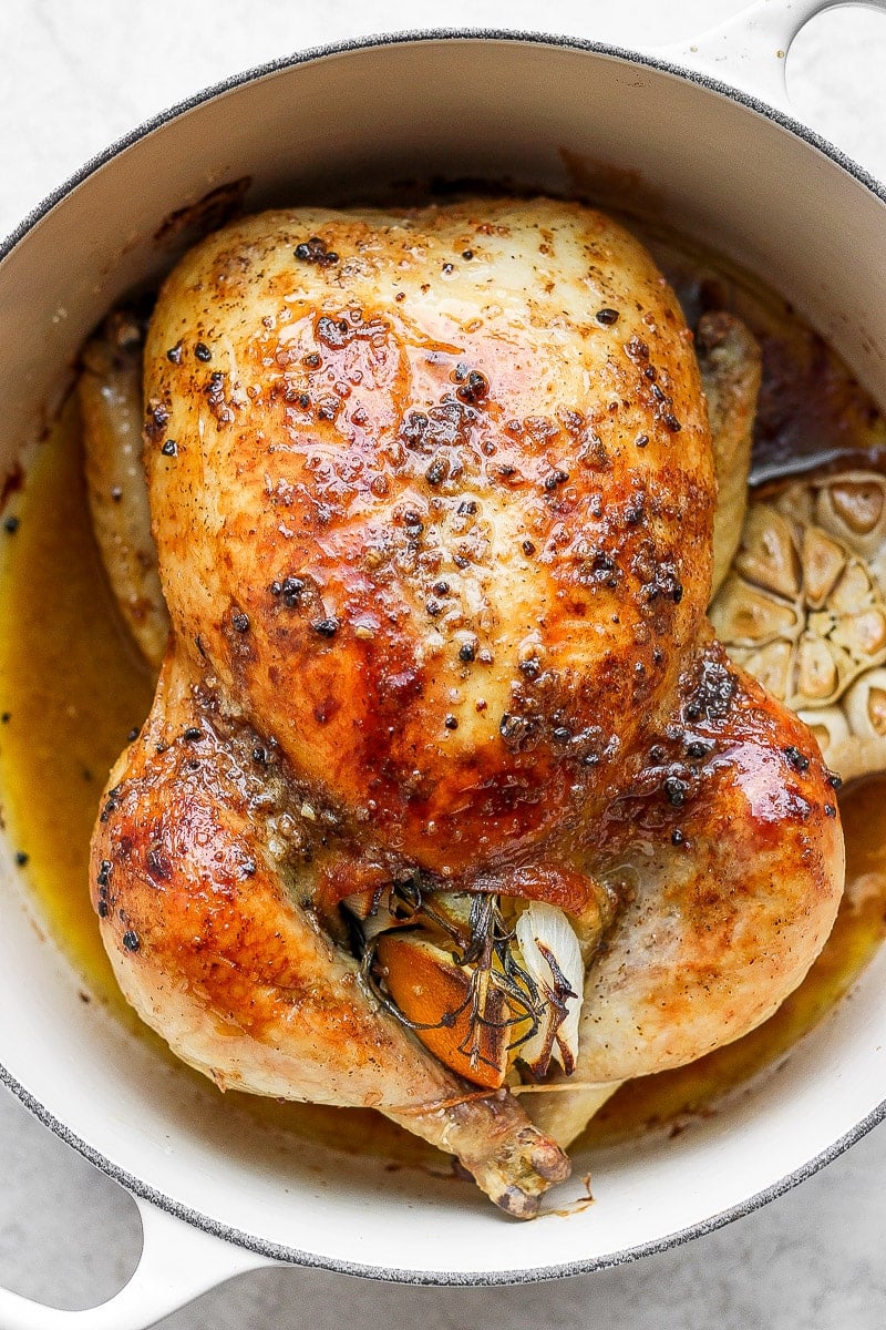 Whole roasted chicken in a dutch oven. 
