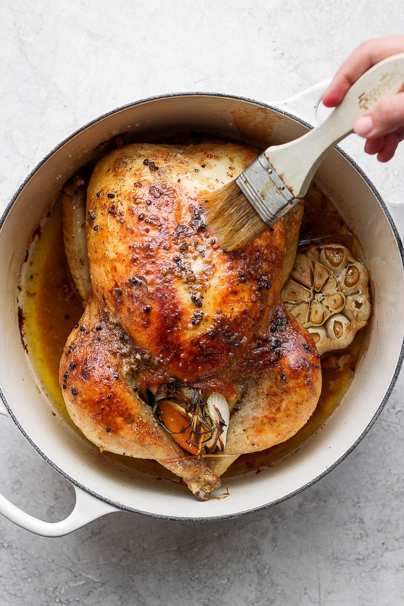 Whole roasted chicken in a dutch oven. 