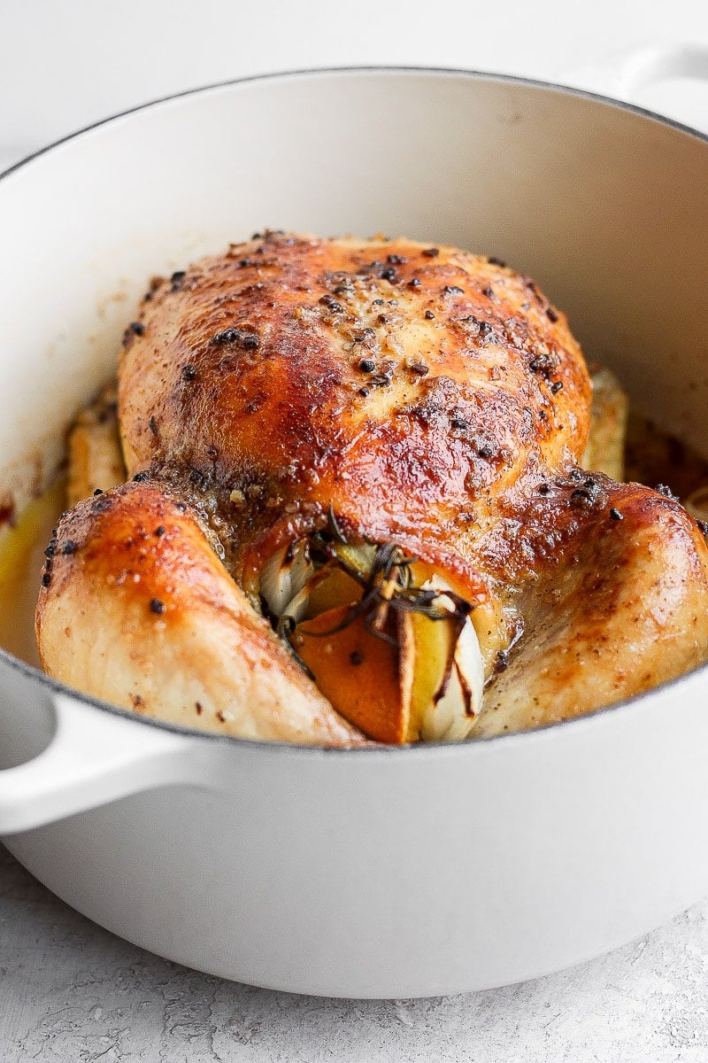 Whole roasted chicken in a dutch oven. 