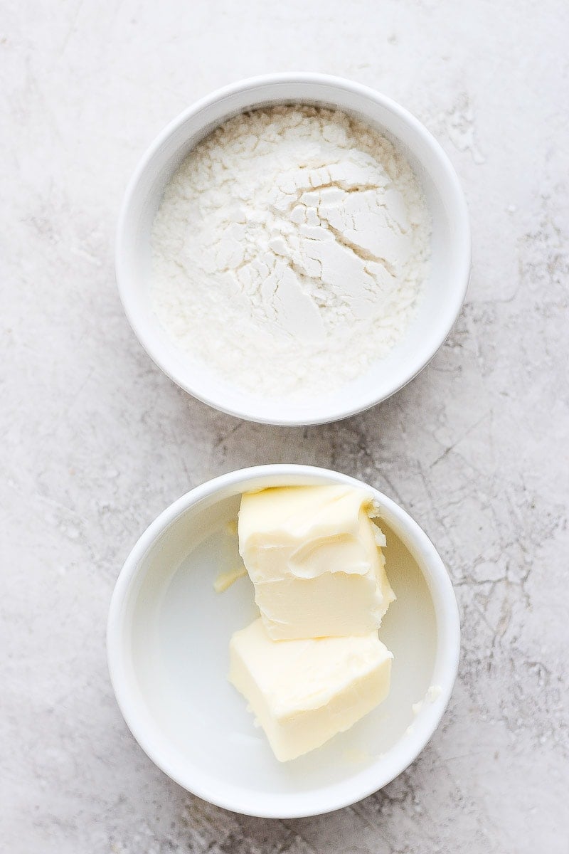 A little bowl of flour and a little bowl of butter. 