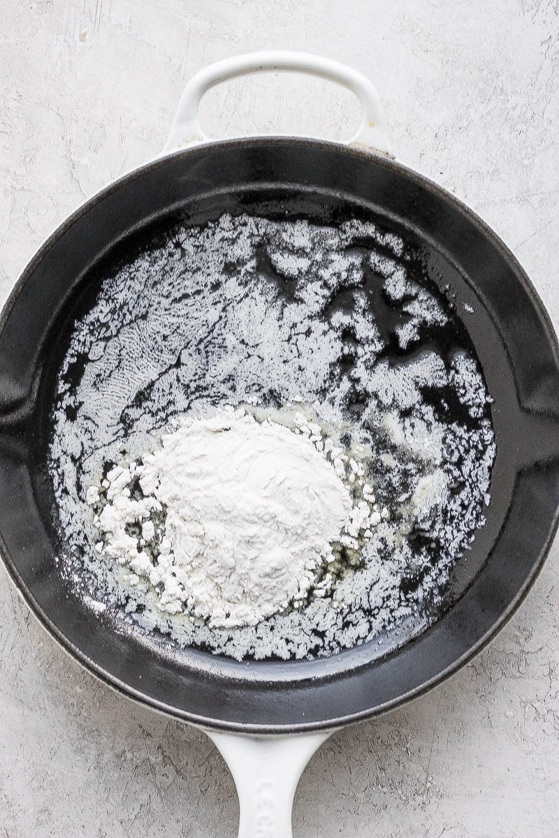 Butter melted in a cast iron skillet with flour. 