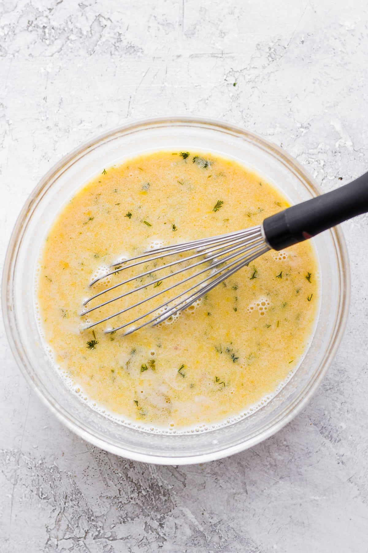 Bowl of tempered egg with lemon juice and broth. 