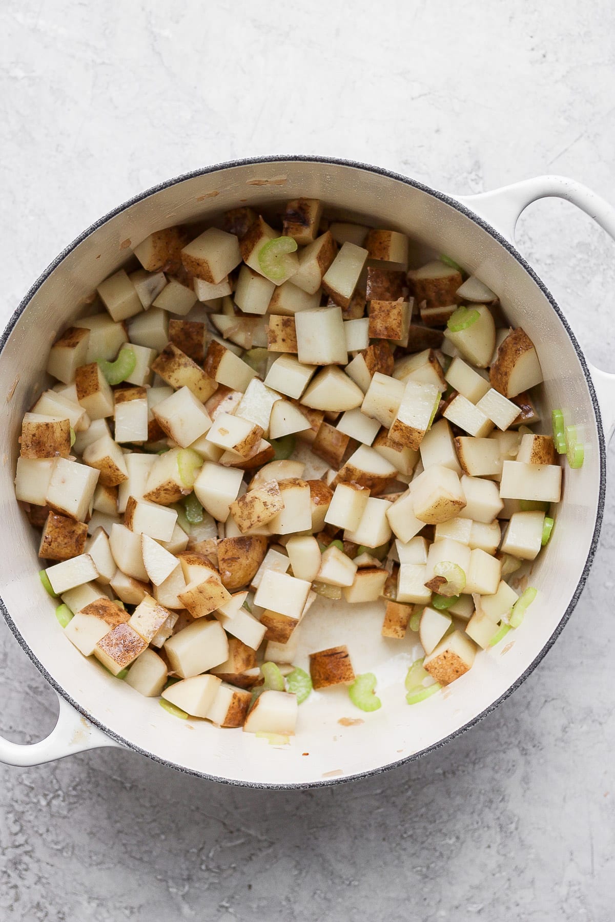 Veggies and potatoes sauteed in a dutch oven.