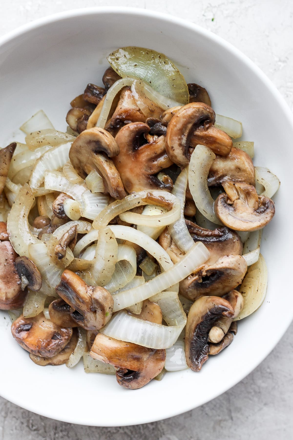 Bowl of sautéed mushrooms and onions.