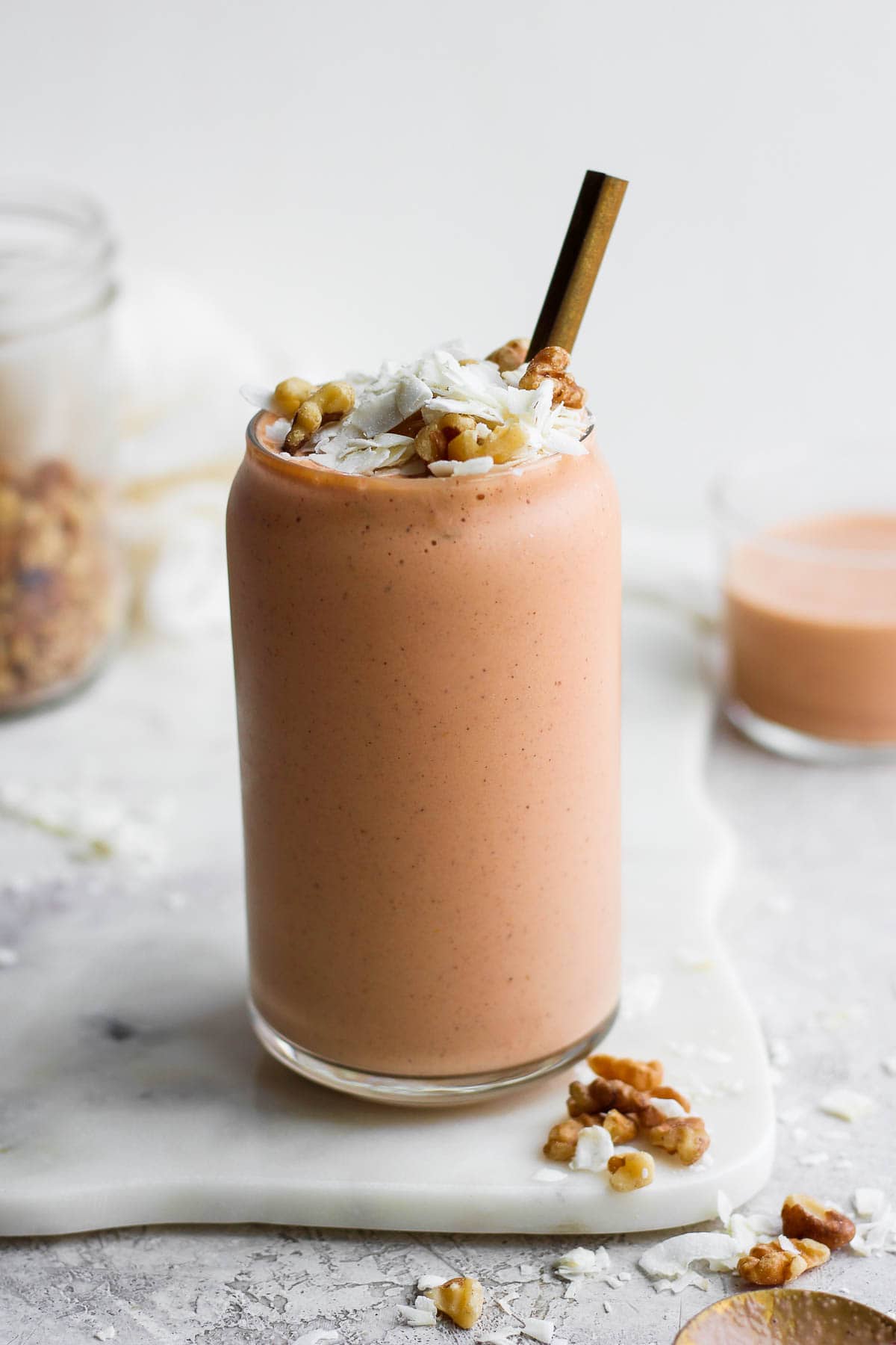 Carrot cake smoothie in a tall glass.