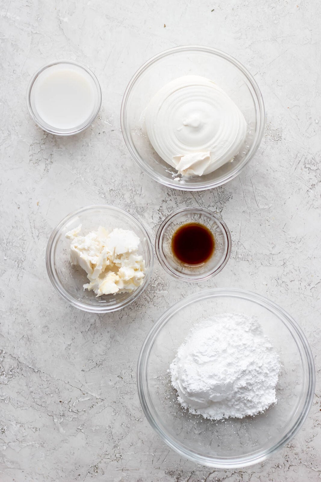Dairy free cream cheese frosting ingredients measured out into bowls.