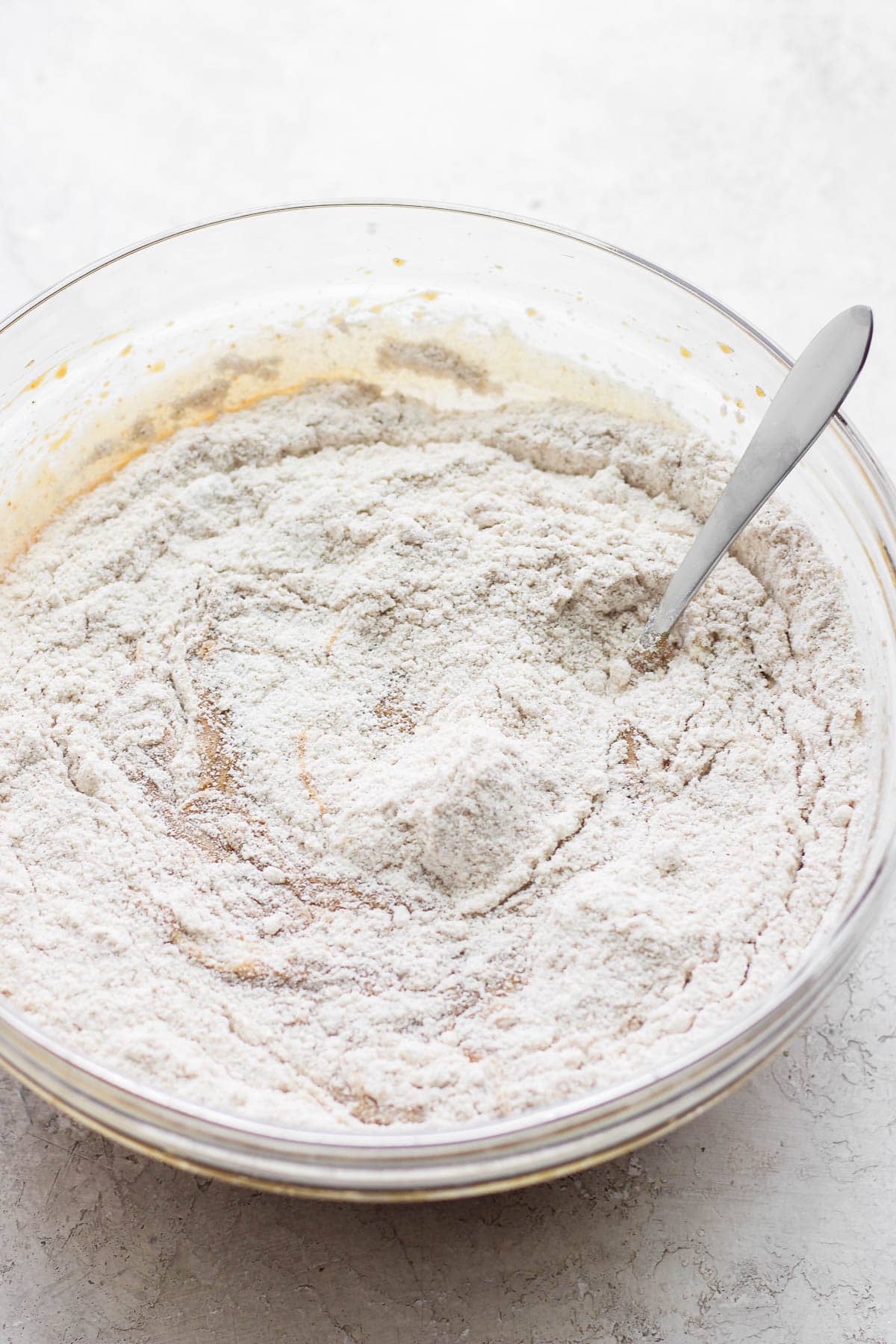 Wet and dry carrot cake mixtures combined into one bowl.