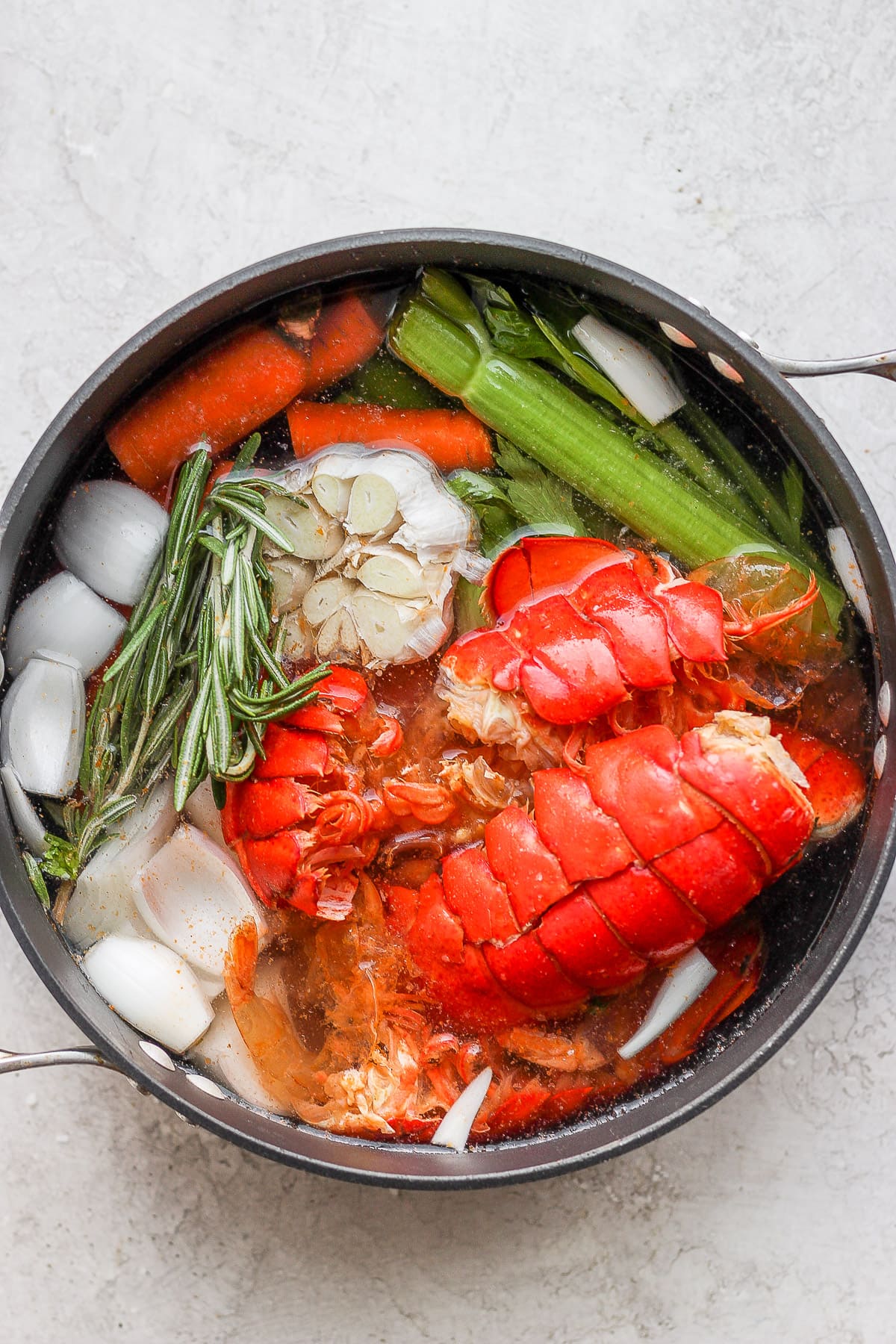 Dutch oven with seafood stock ingredients plus water.