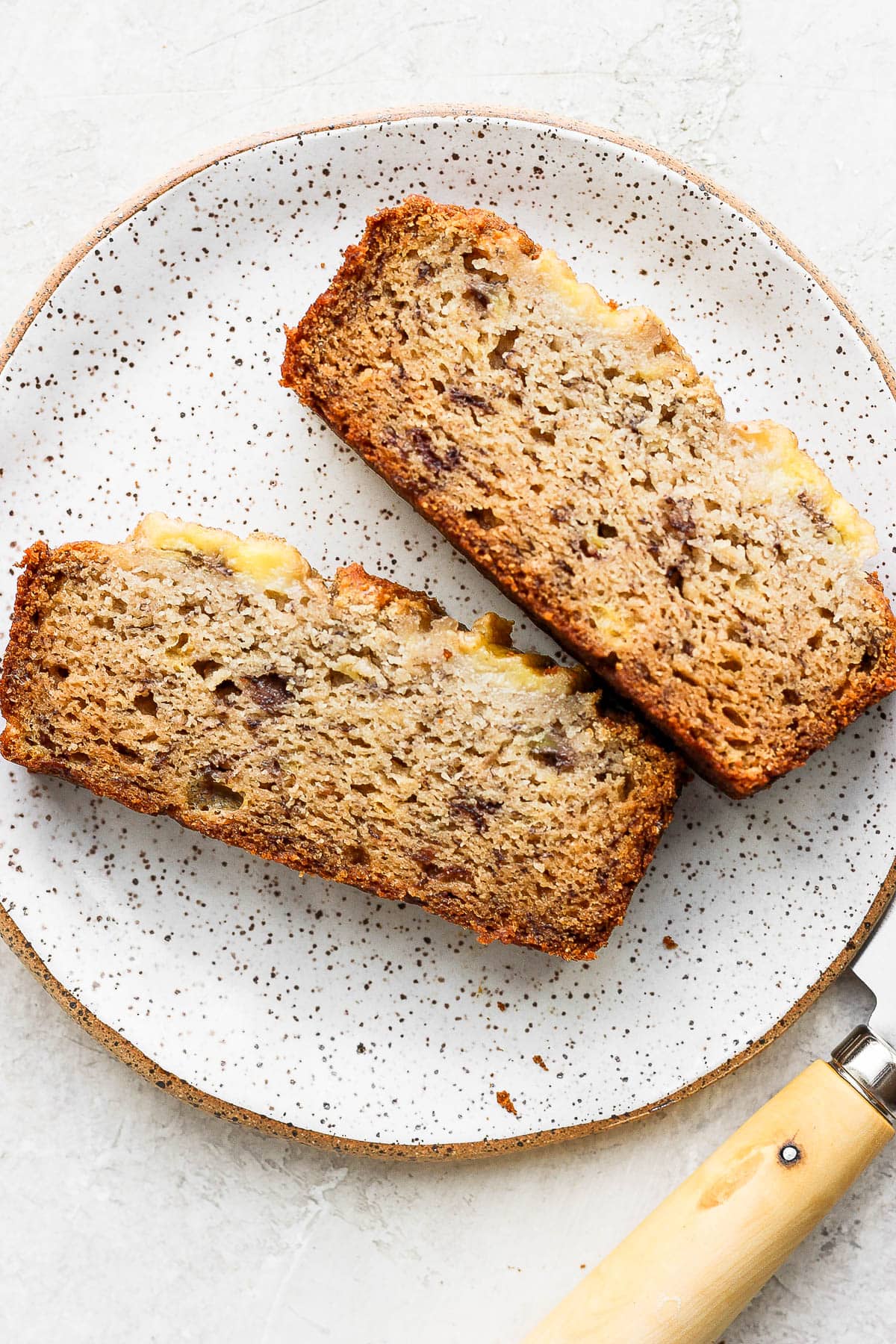 A plate with 2 slices of paleo banana bread.