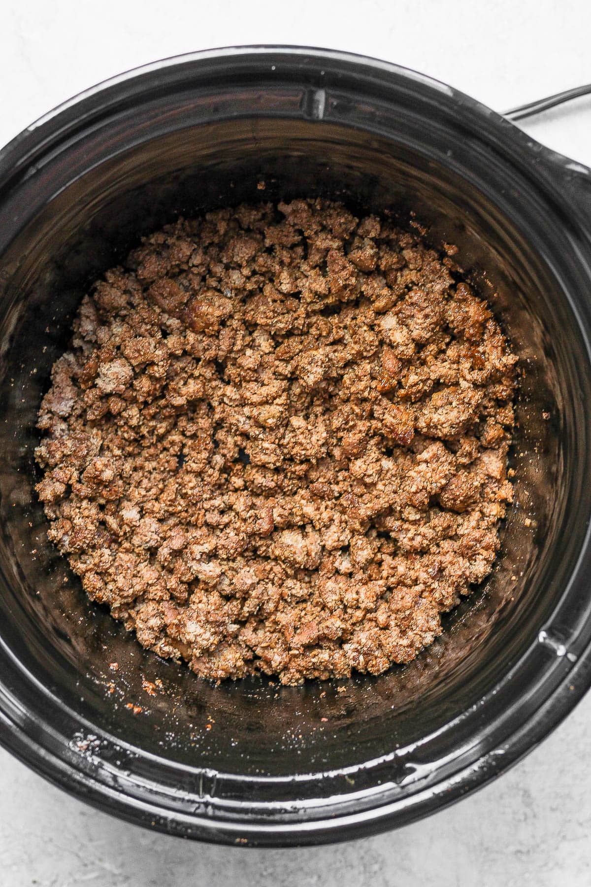 Crockpot with cooked taco meat.
