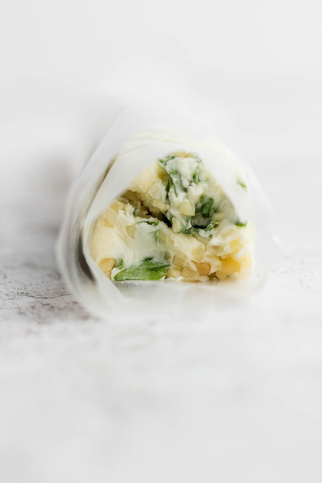 Herbed butter rolled in wax paper.