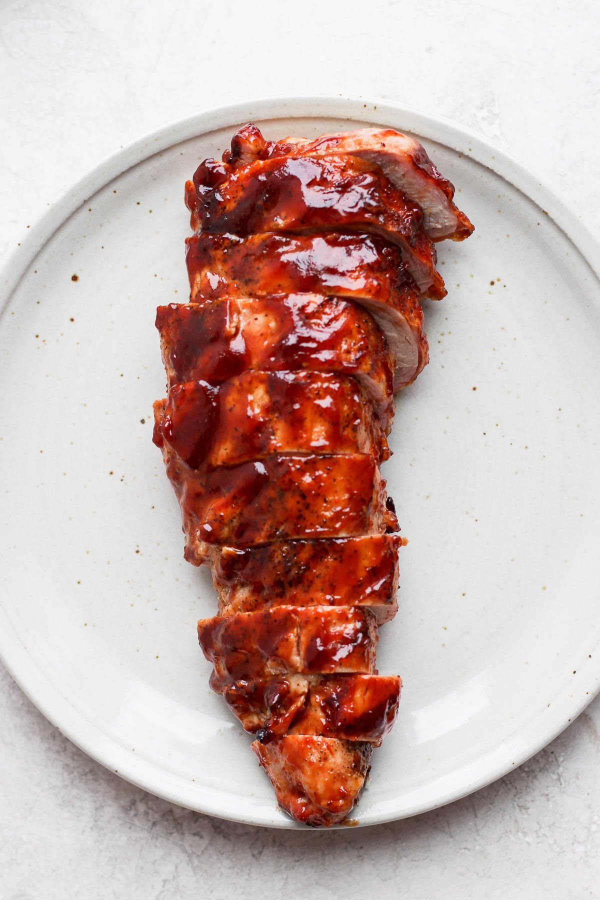 BBQ pork tenderloin on a plate. 