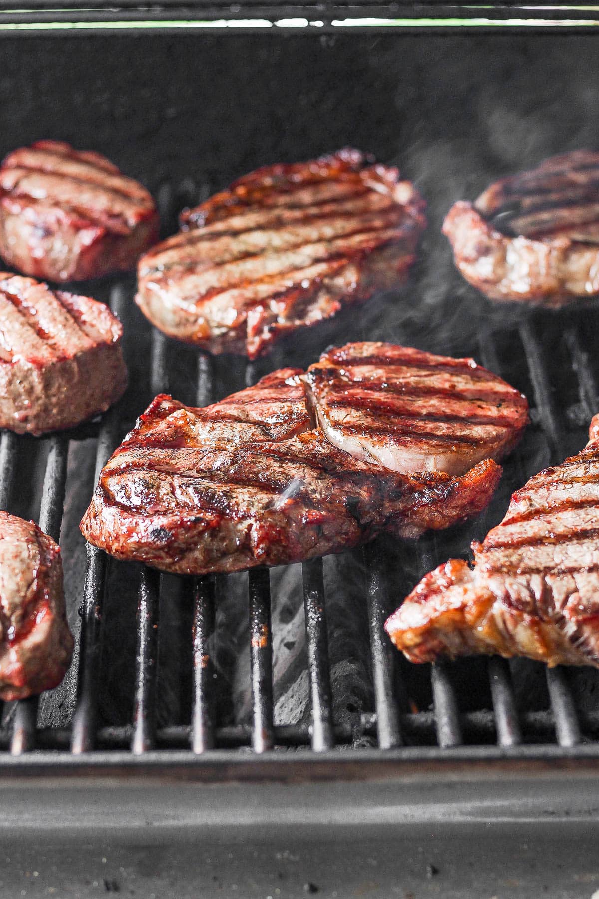 Grilled steaks on a grill.