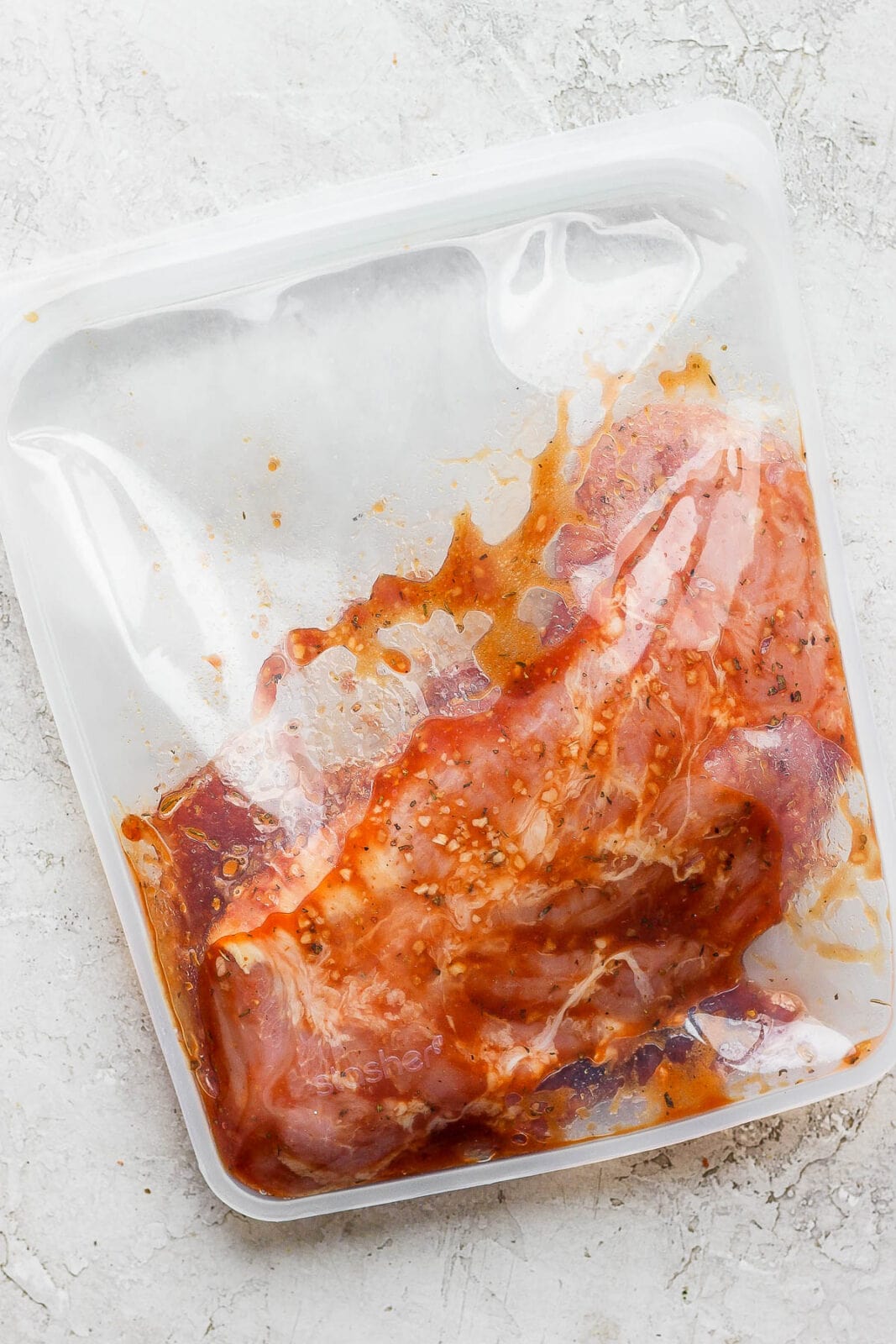 Pork tenderloin marinating in a stasher bag. 