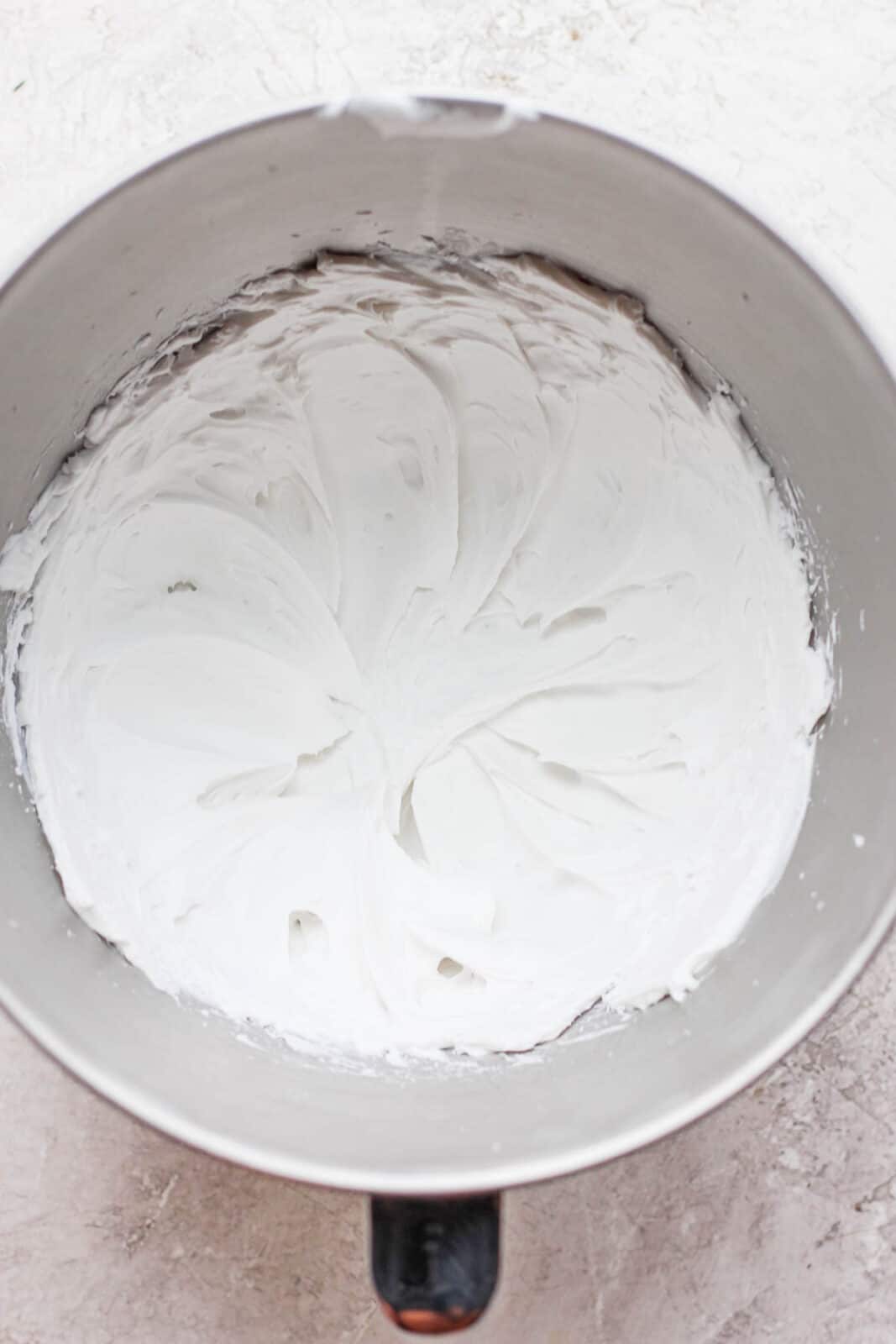 Whipped coconut cream in a bowl.