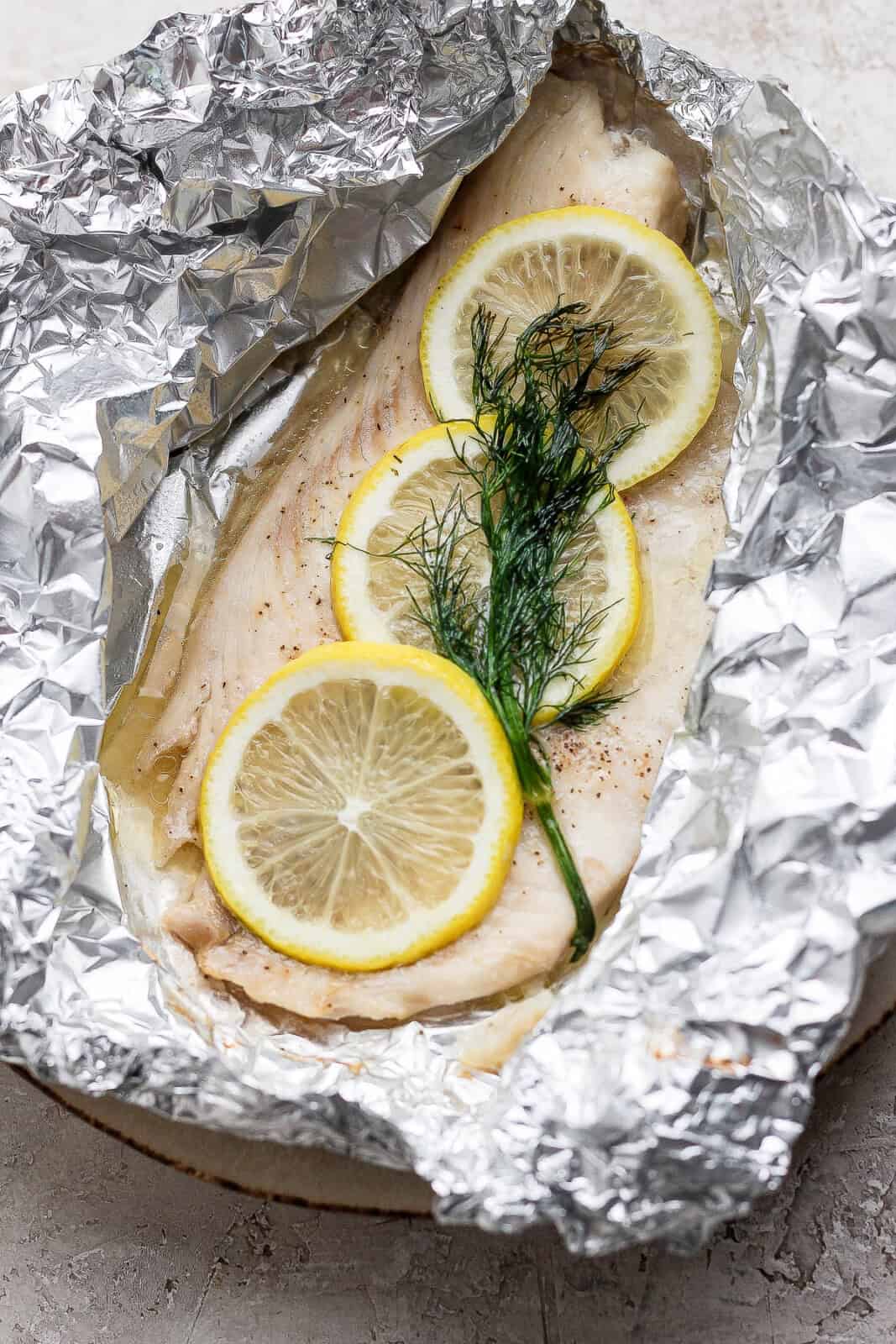 Tilapia filet cooked in a foil packed with lemon and dill.