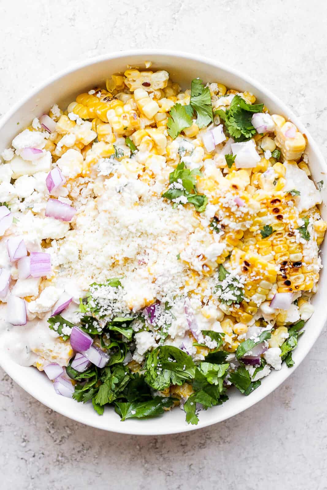 A bowl of mexican street corn salad.