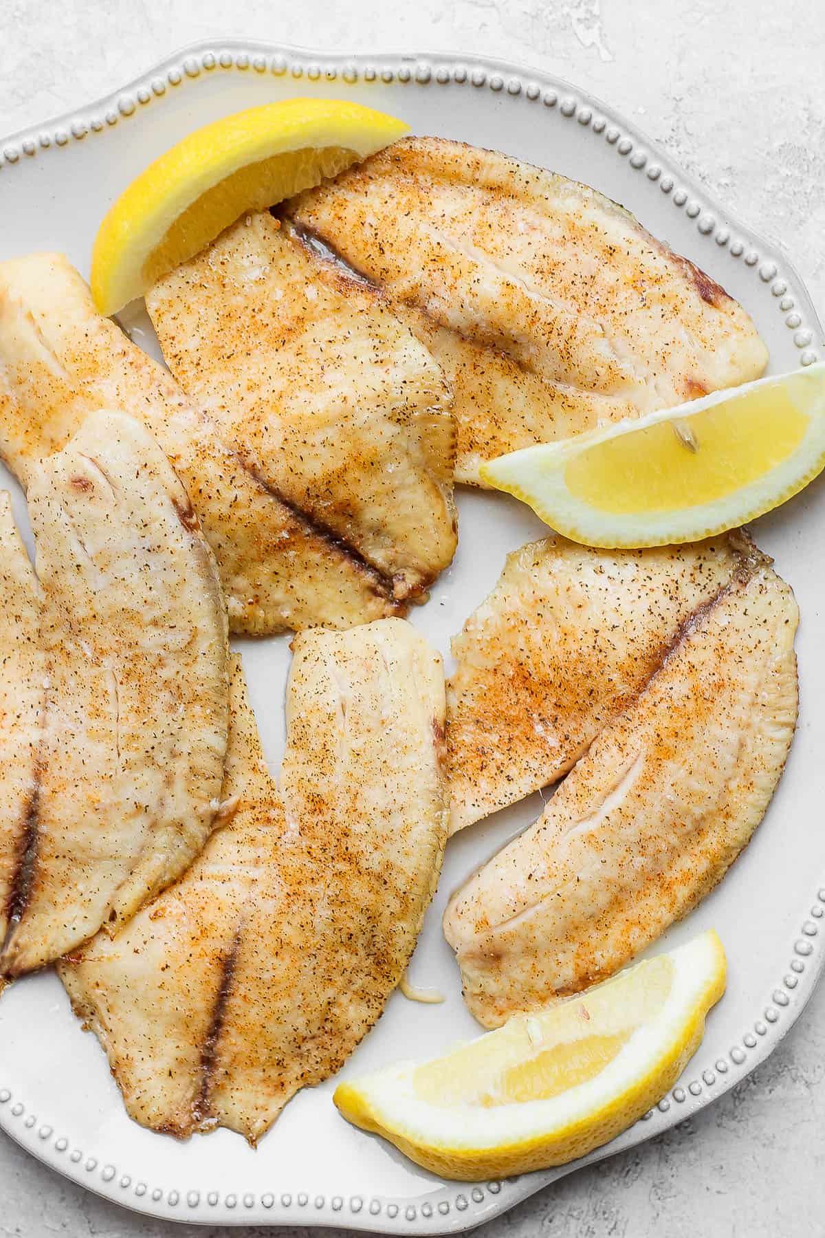 https://thewoodenskillet.com/wp-content/uploads/2021/06/oven-baked-tilapia-recipe-6.jpg