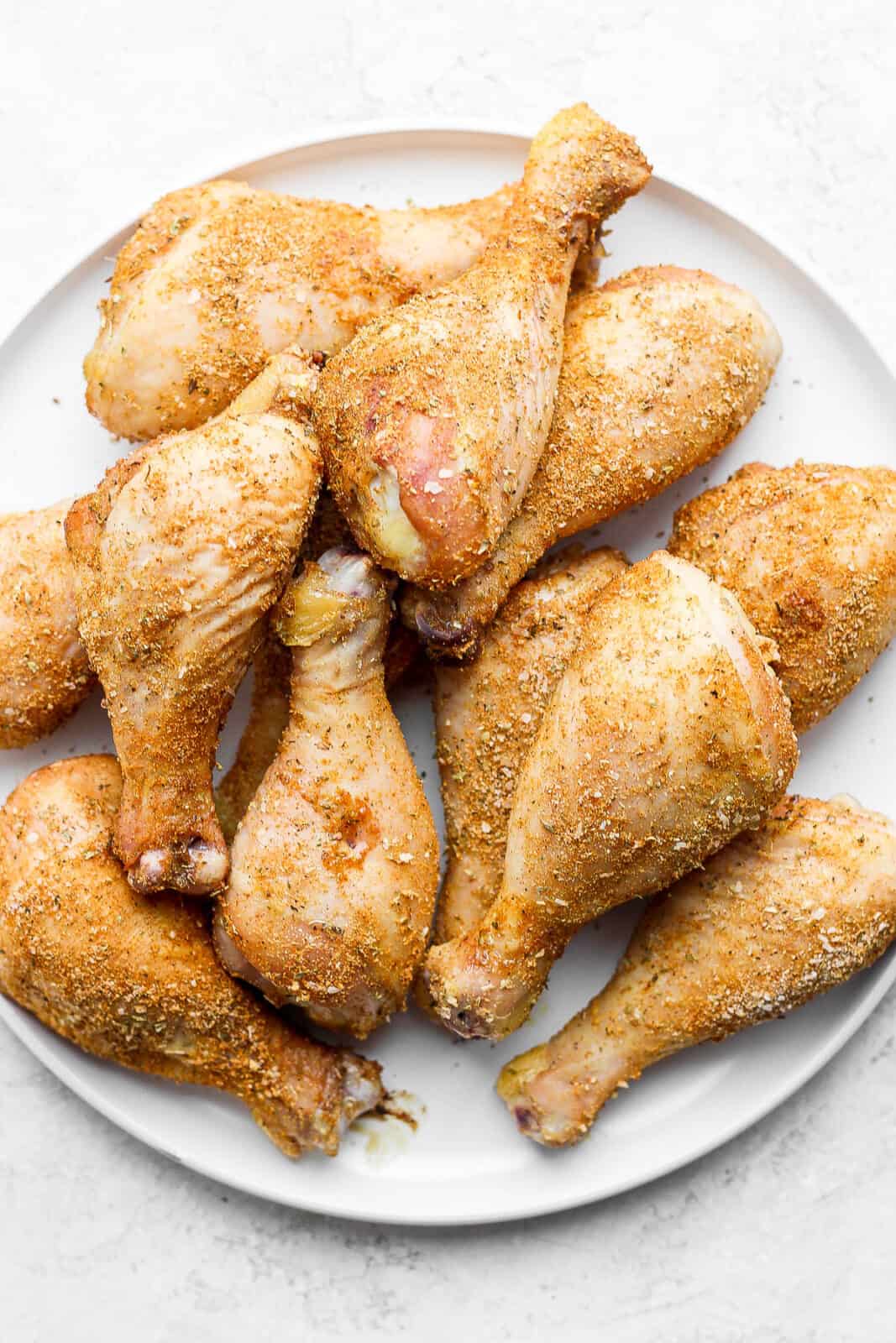 A large platter of chicken legs.