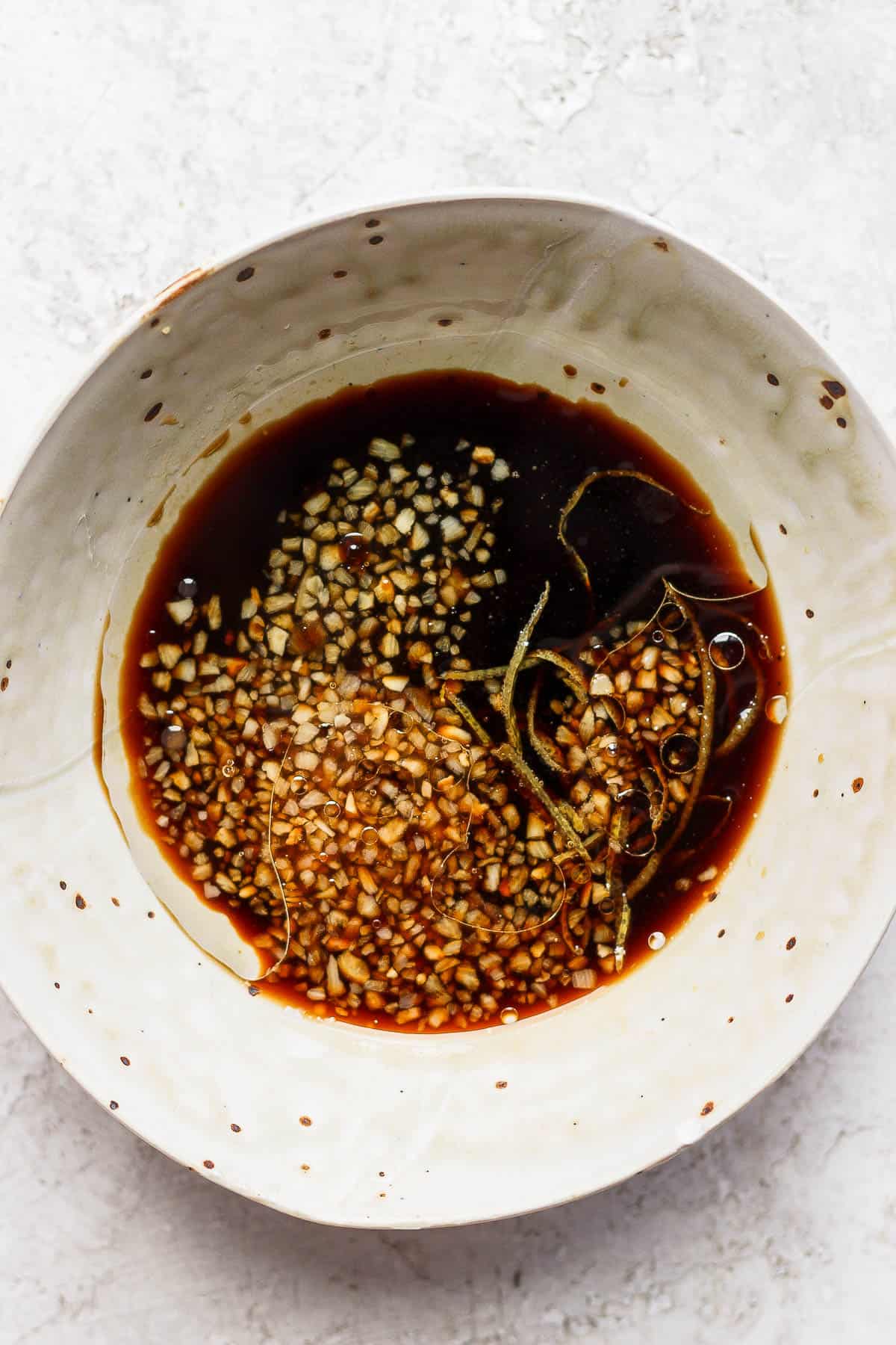 Chicken marinade ingredients mixed together in one bowl.