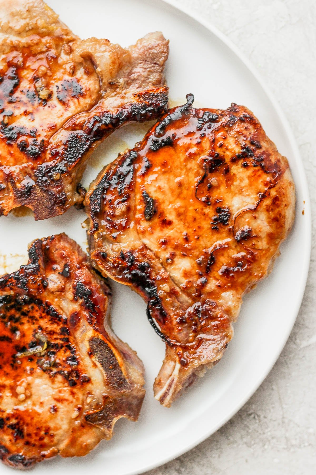 Cast iron pork chops on a plate.