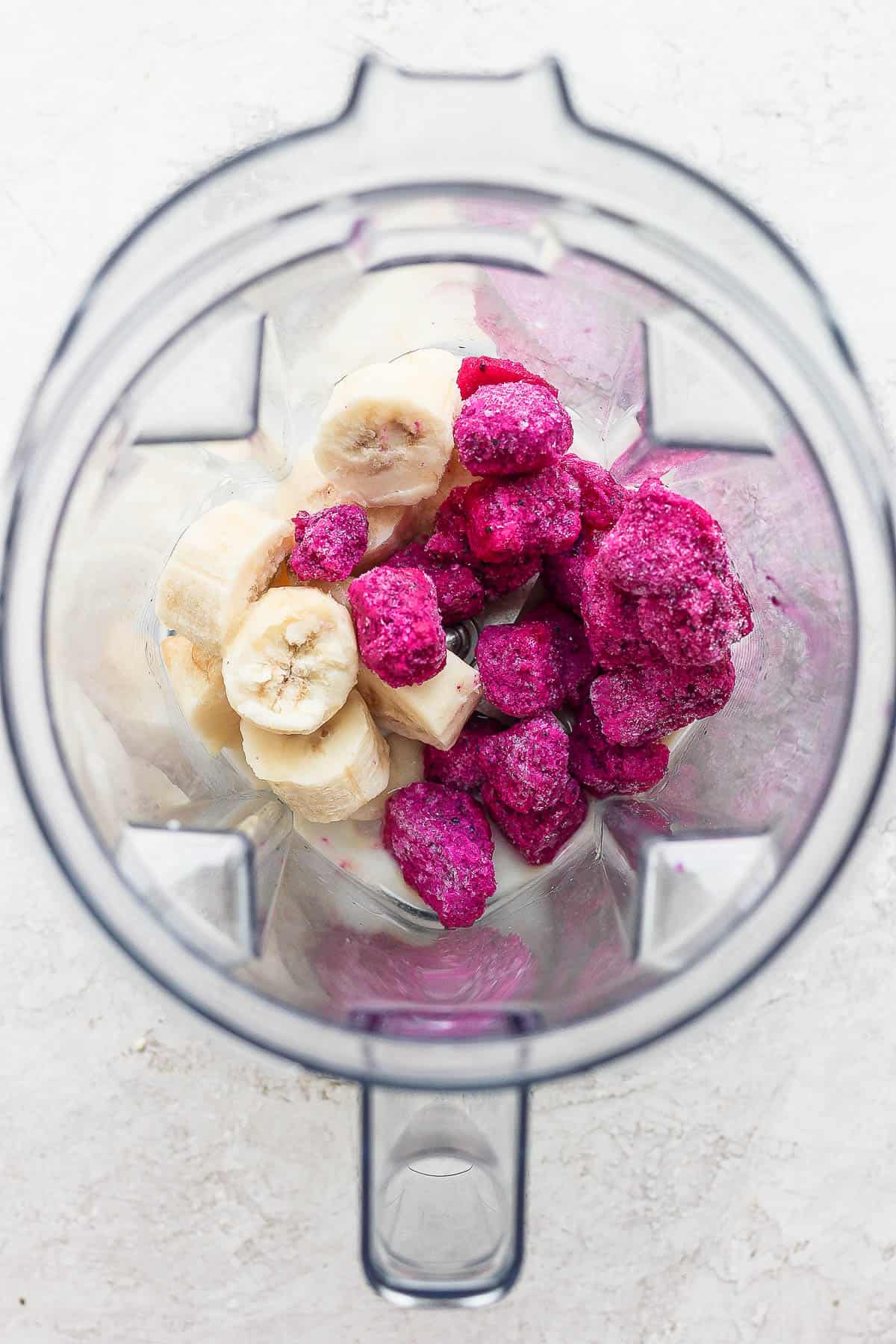 Dragonfruit smoothie ingredients in a blender.