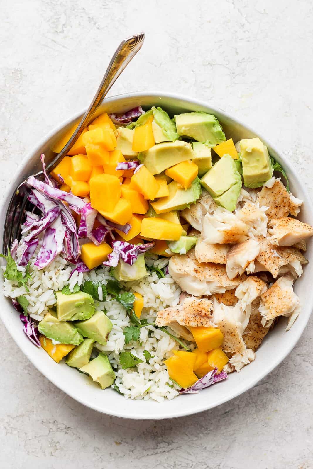 https://thewoodenskillet.com/wp-content/uploads/2021/07/fish-taco-bowl-recipe-2-1067x1600.jpg