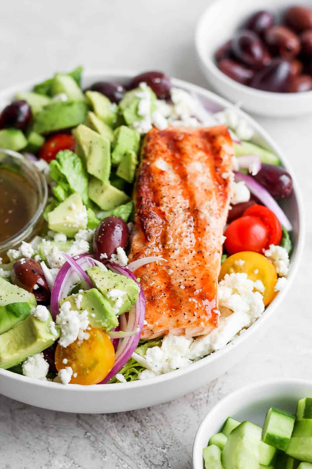 A bowl of grilled salmon salad. 