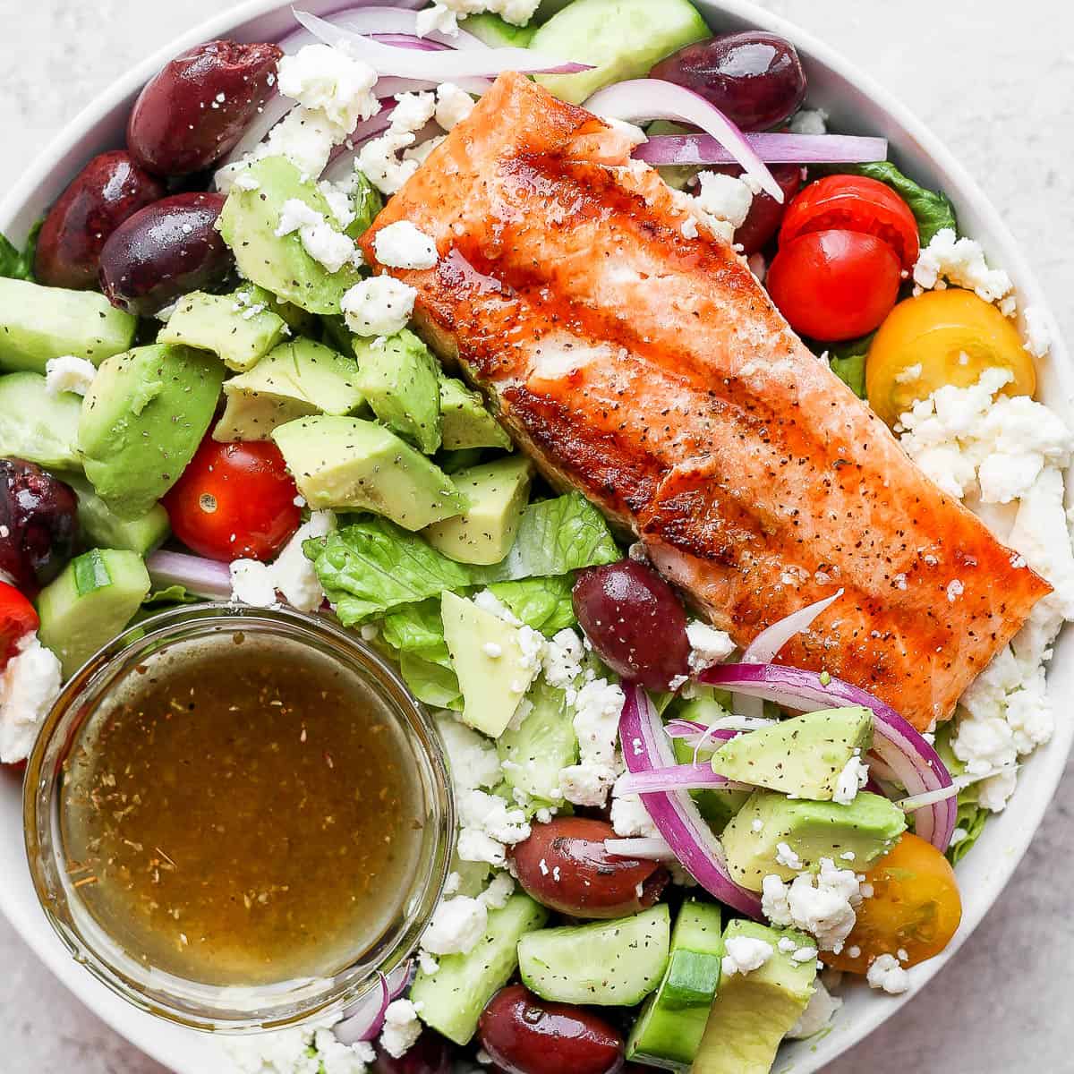 Bowl of grilled salmon salad.