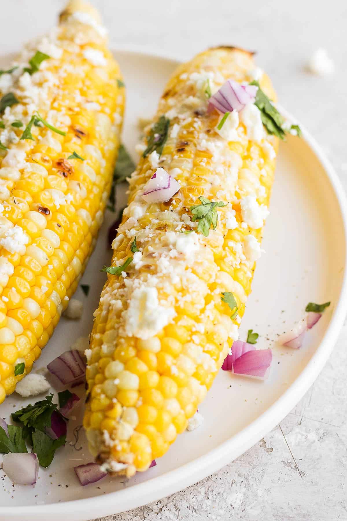 Mexican street corn on a plate.