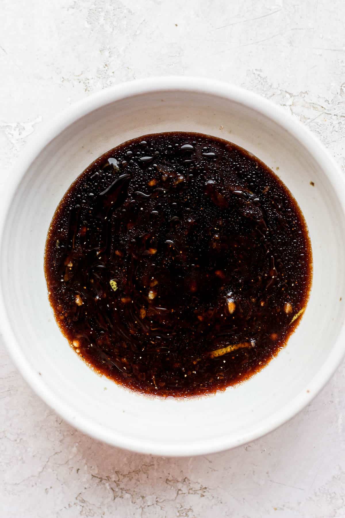 Balsamic apricot marinade ingredients in a bowl.