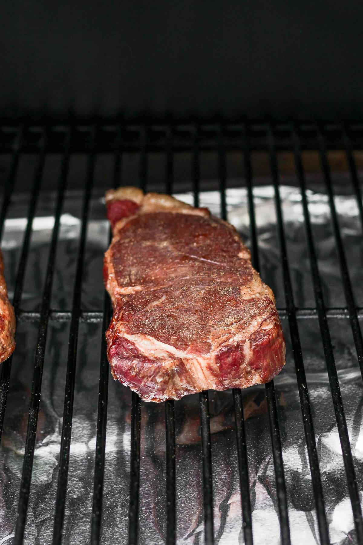 A smoked steak on a smoker.
