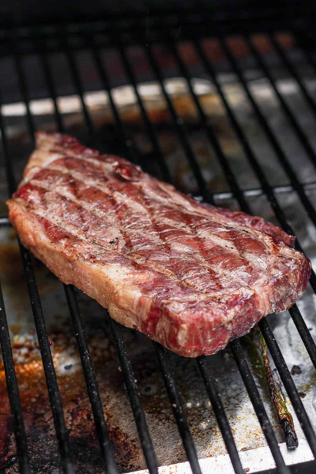 A reverse seared steak on a smoker. 