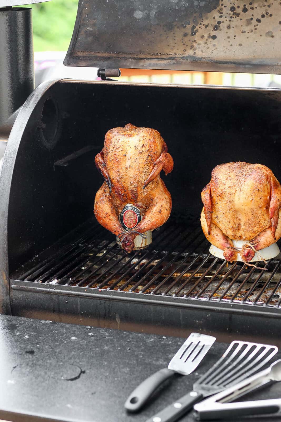 Two different chickens on the smoker. 