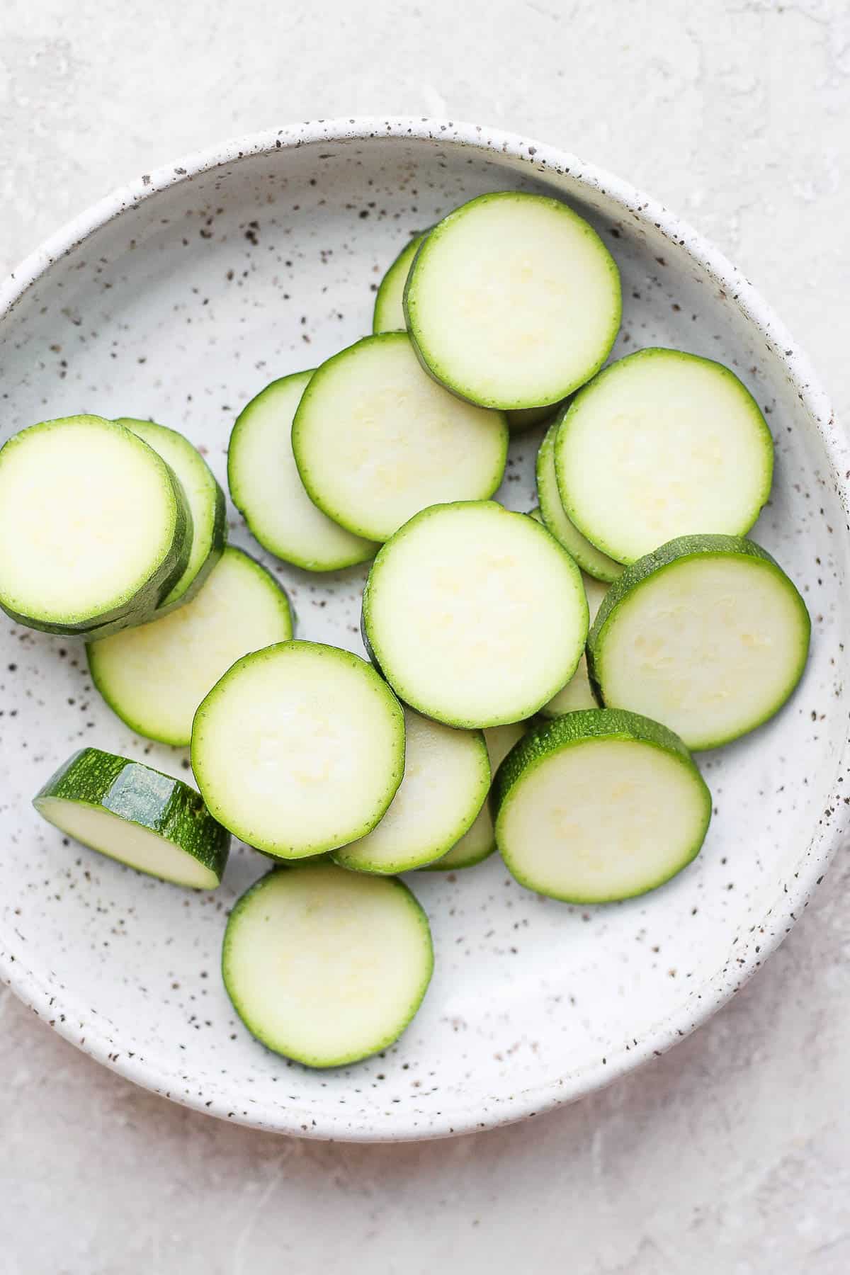 Slices of zucchini in a bowl. 