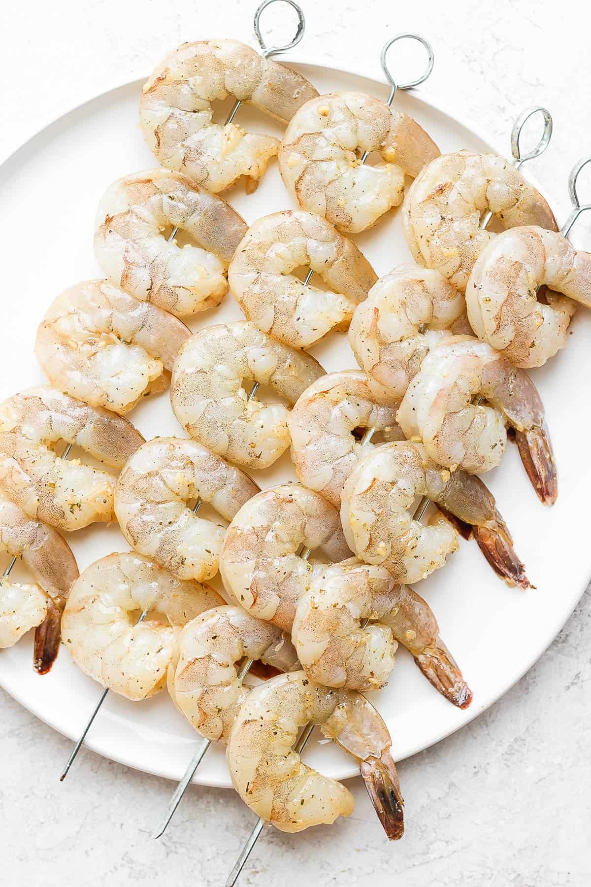 Seasoned shrimp on skewers.