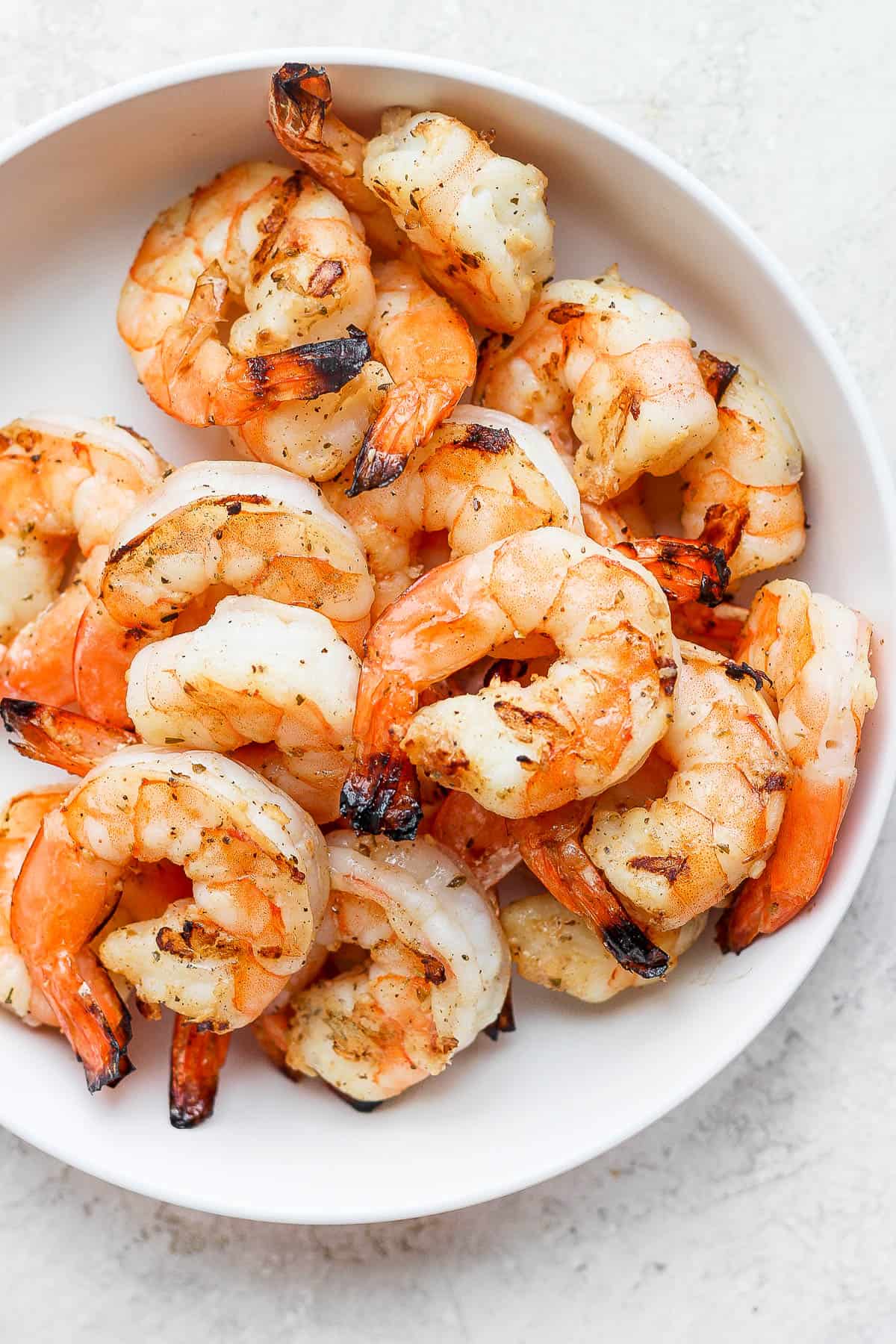 Grilled shrimp in a bowl.