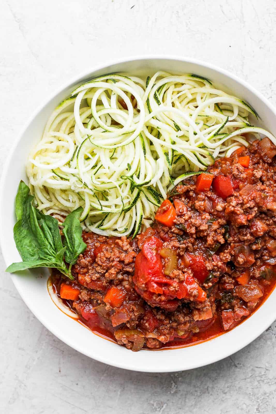 Bowl of bolognese with zucchini noodles.