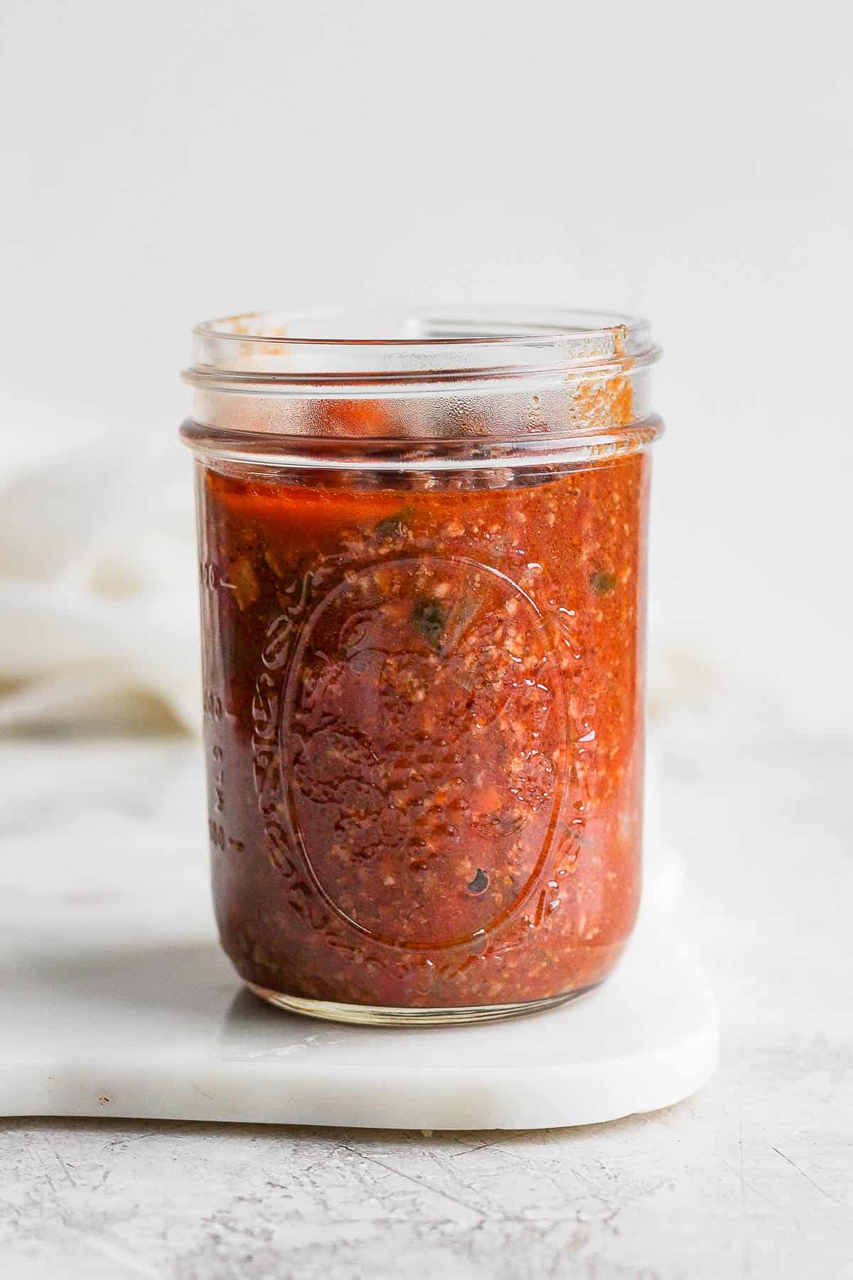 Mason jar of bolognese sauce.