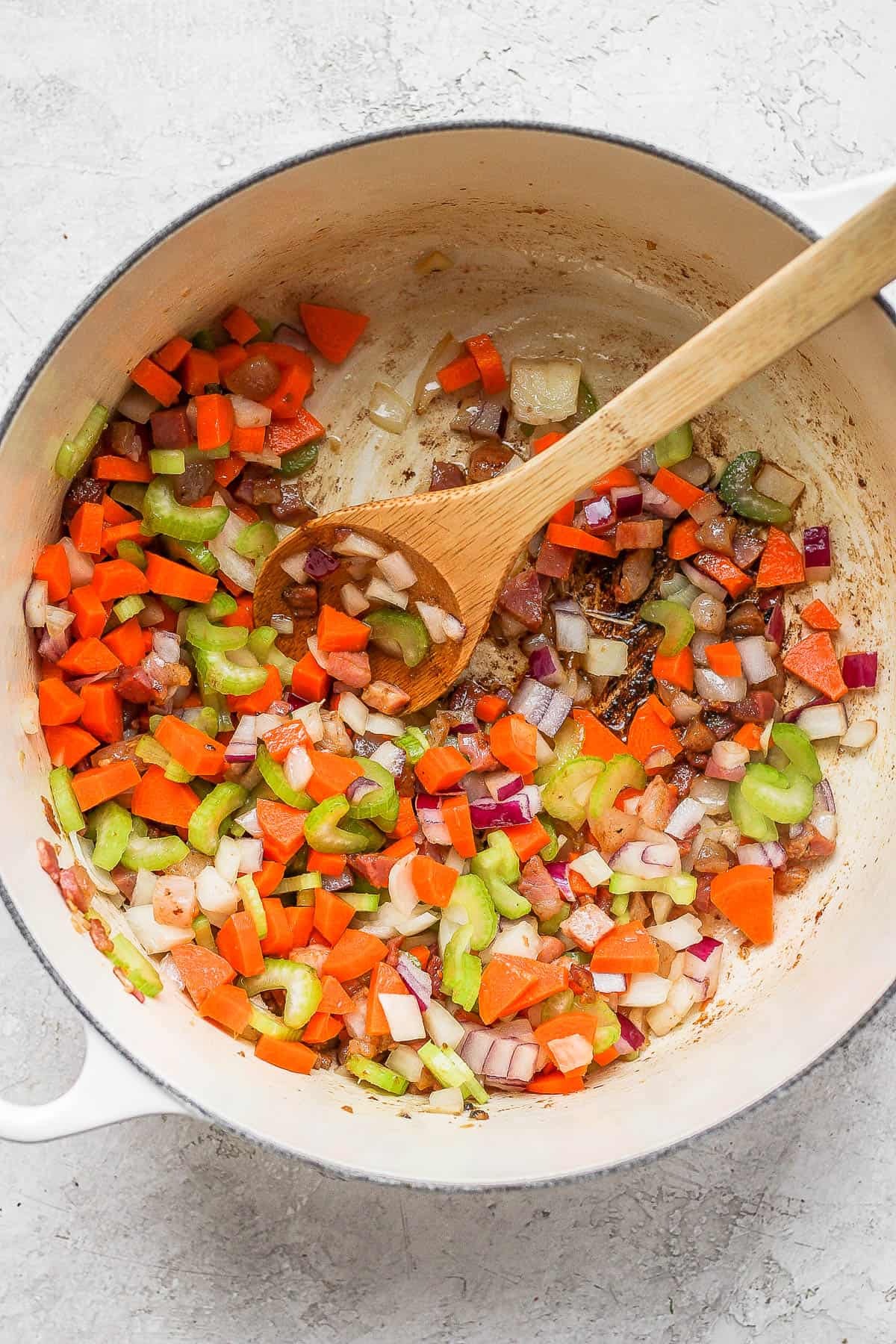 Dutch oven full of sautéed veggies.