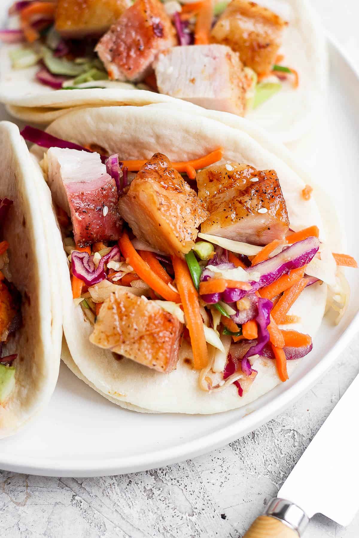 Up close shot of a pork belly taco.