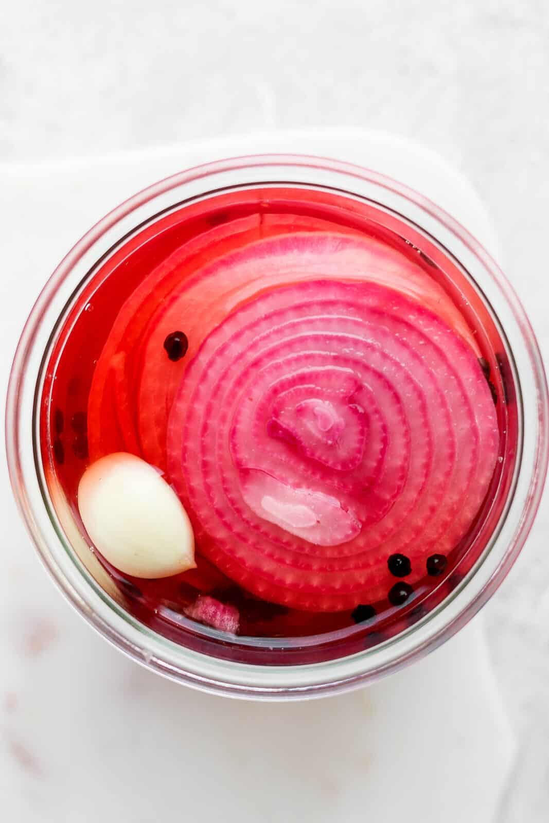 Top shot of quick pickled onions in a jar.