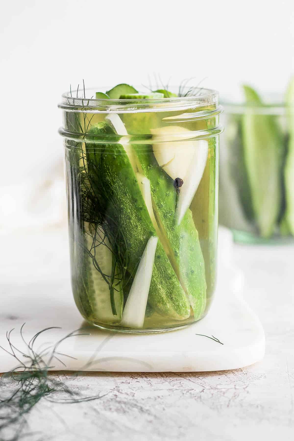 A mason jar of refrigerator dill pickles. 