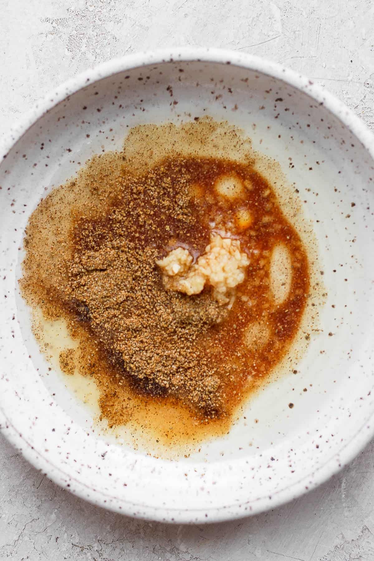 Shrimp marinade ingredients in a bowl.