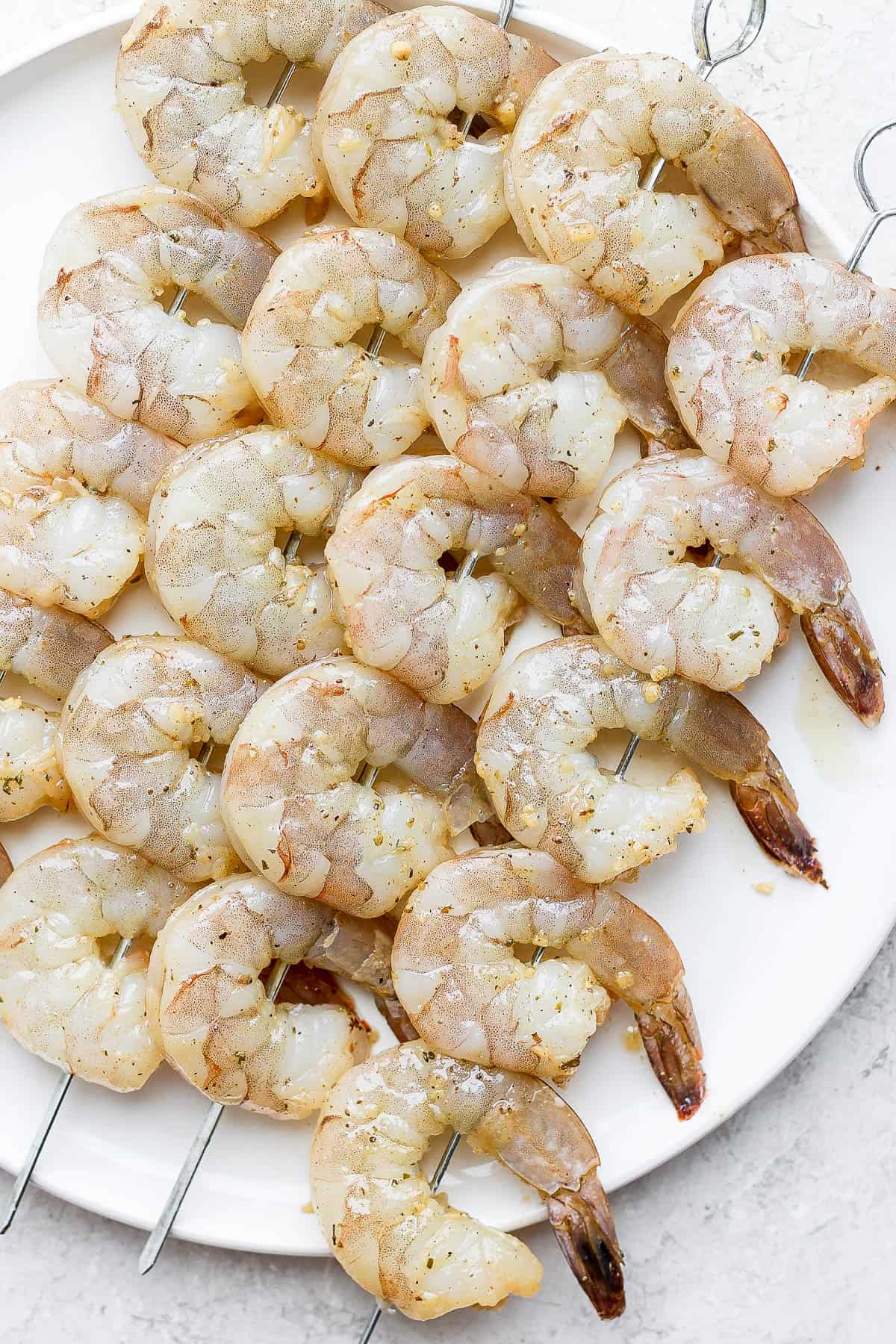 Marinated shrimp on skewers.