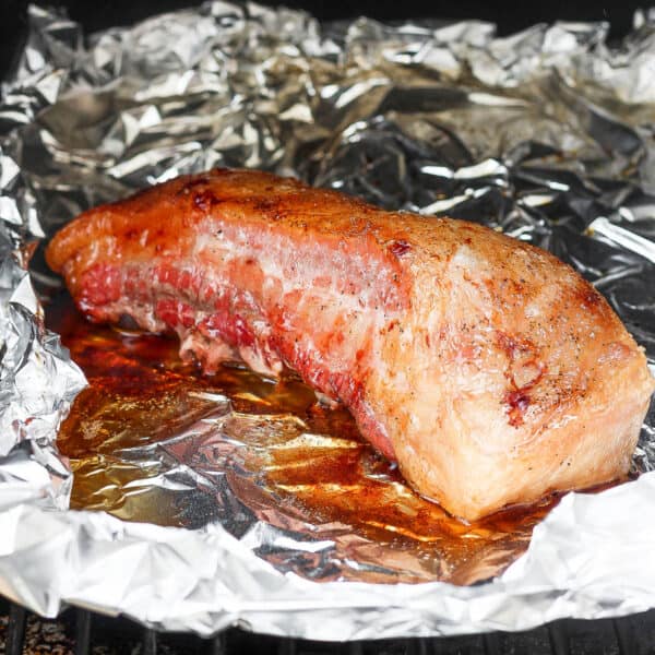 Smoked pork belly in foil.