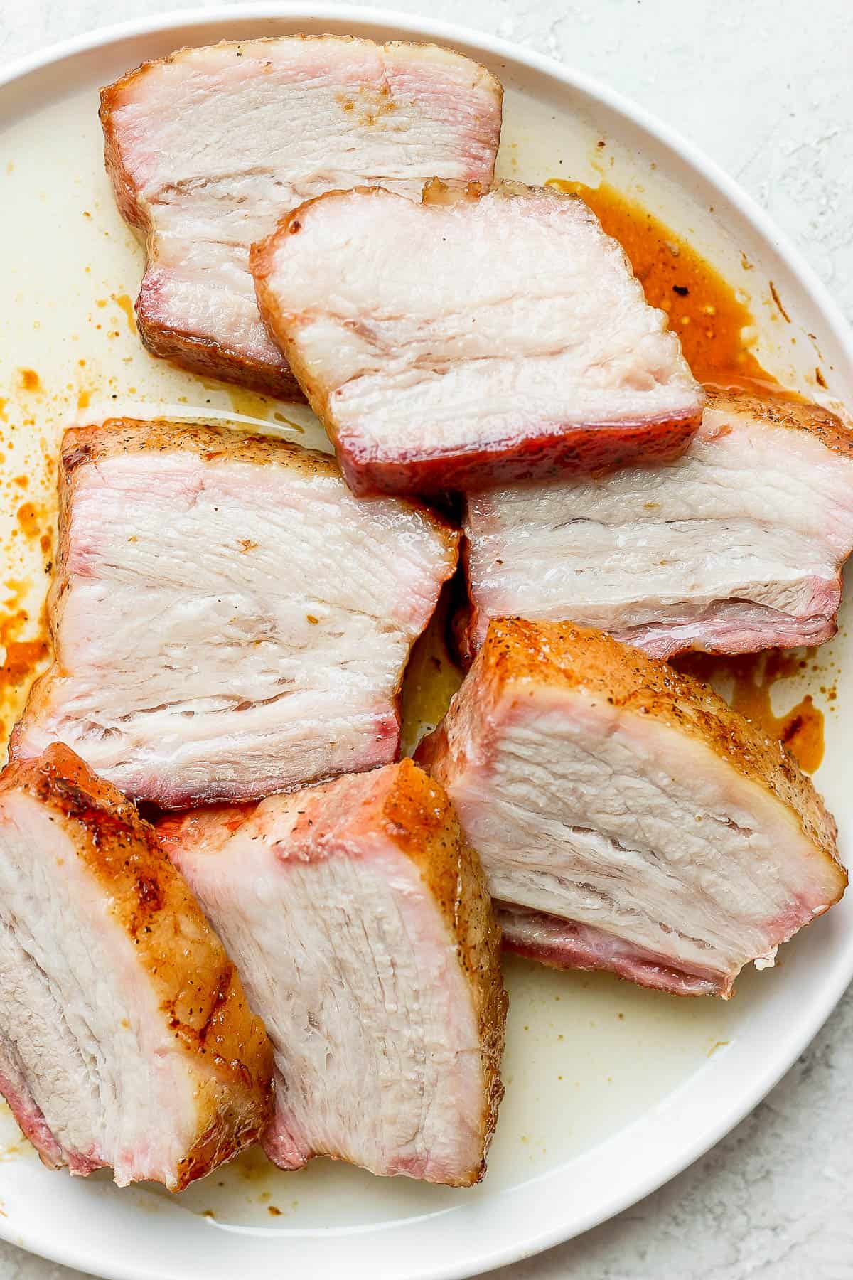 A plate of pork belly slices.
