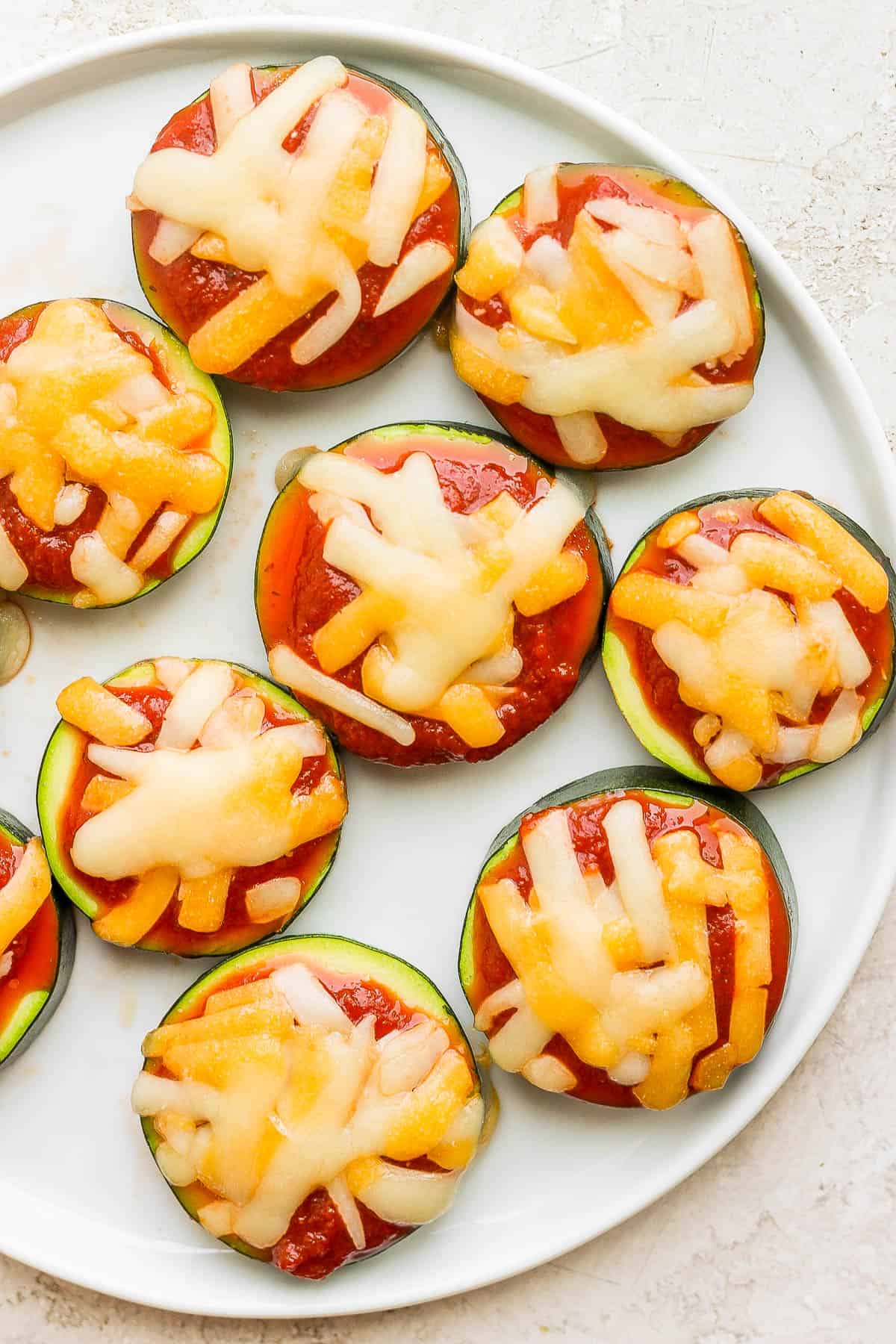 A plate of zucchini pizza bites.