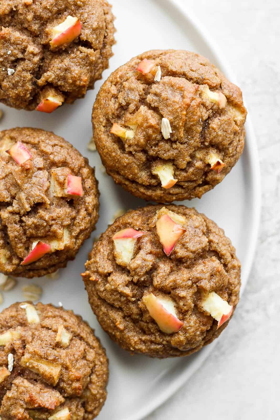 Apple cinnamon muffins on a plate.